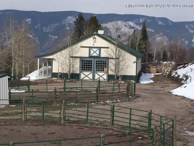 4000 Juniper Hill Road Aspen, CO 81611 - Photo 2 of 63 a front view of a house with parking yard