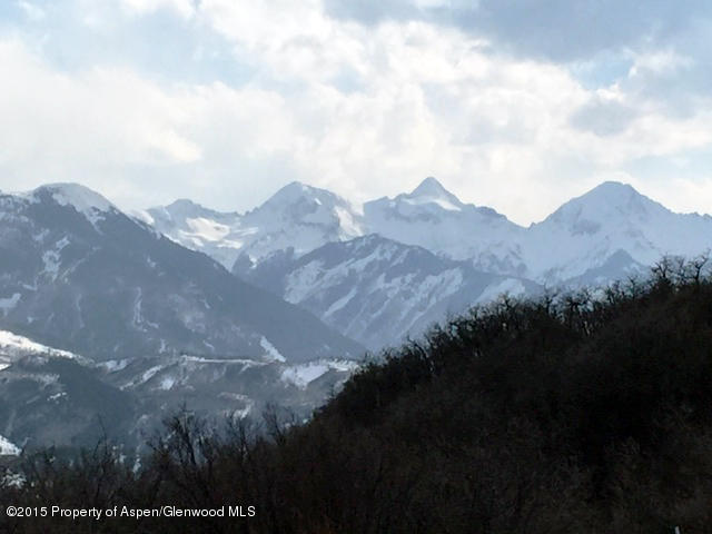 4000 Juniper Hill Road Aspen, CO 81611 - Photo 21 of 63 a view of a house with a mountain and a forest