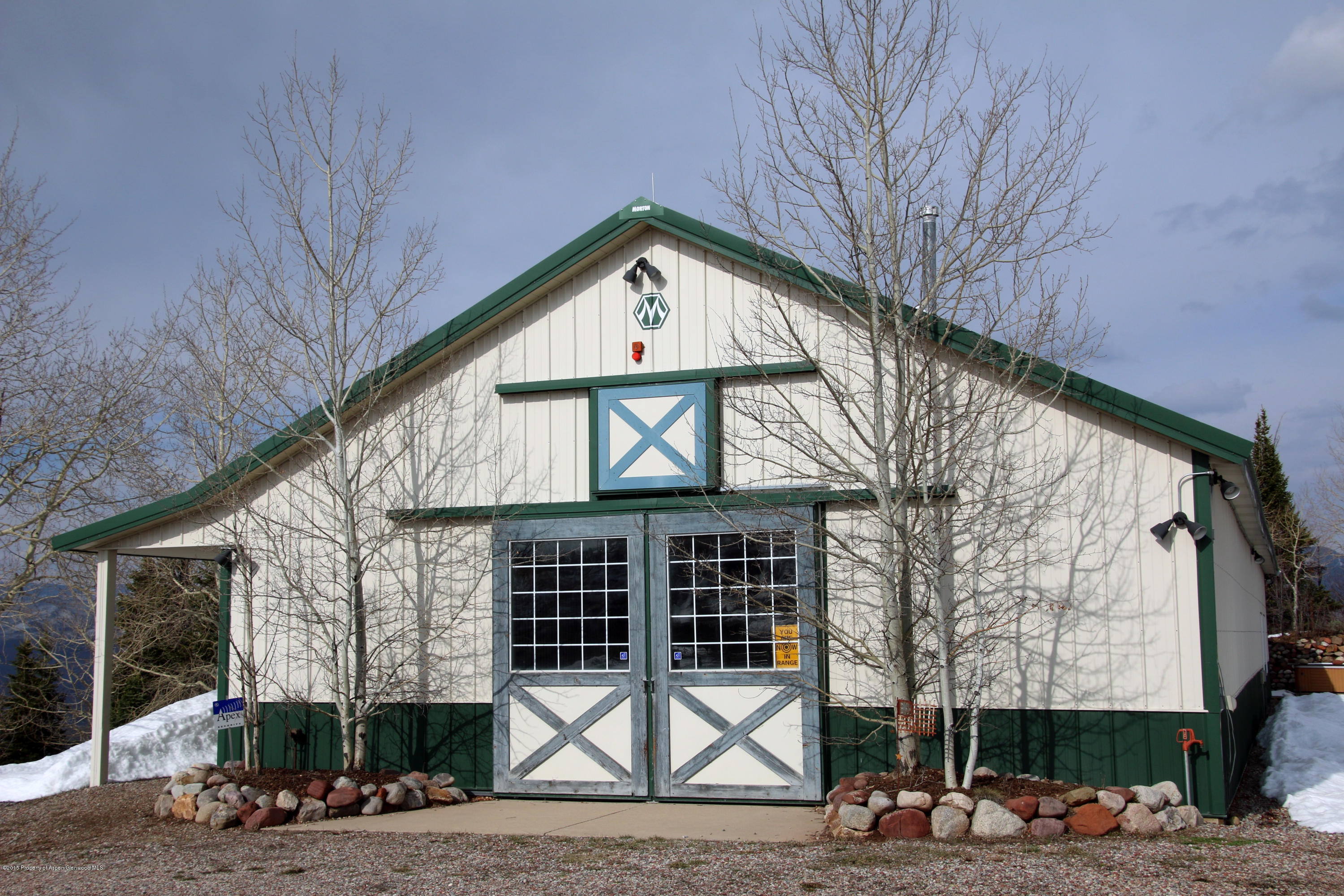 4000 Juniper Hill Road Aspen, CO 81611 - Photo 31 of 63 a front view of a house with garden