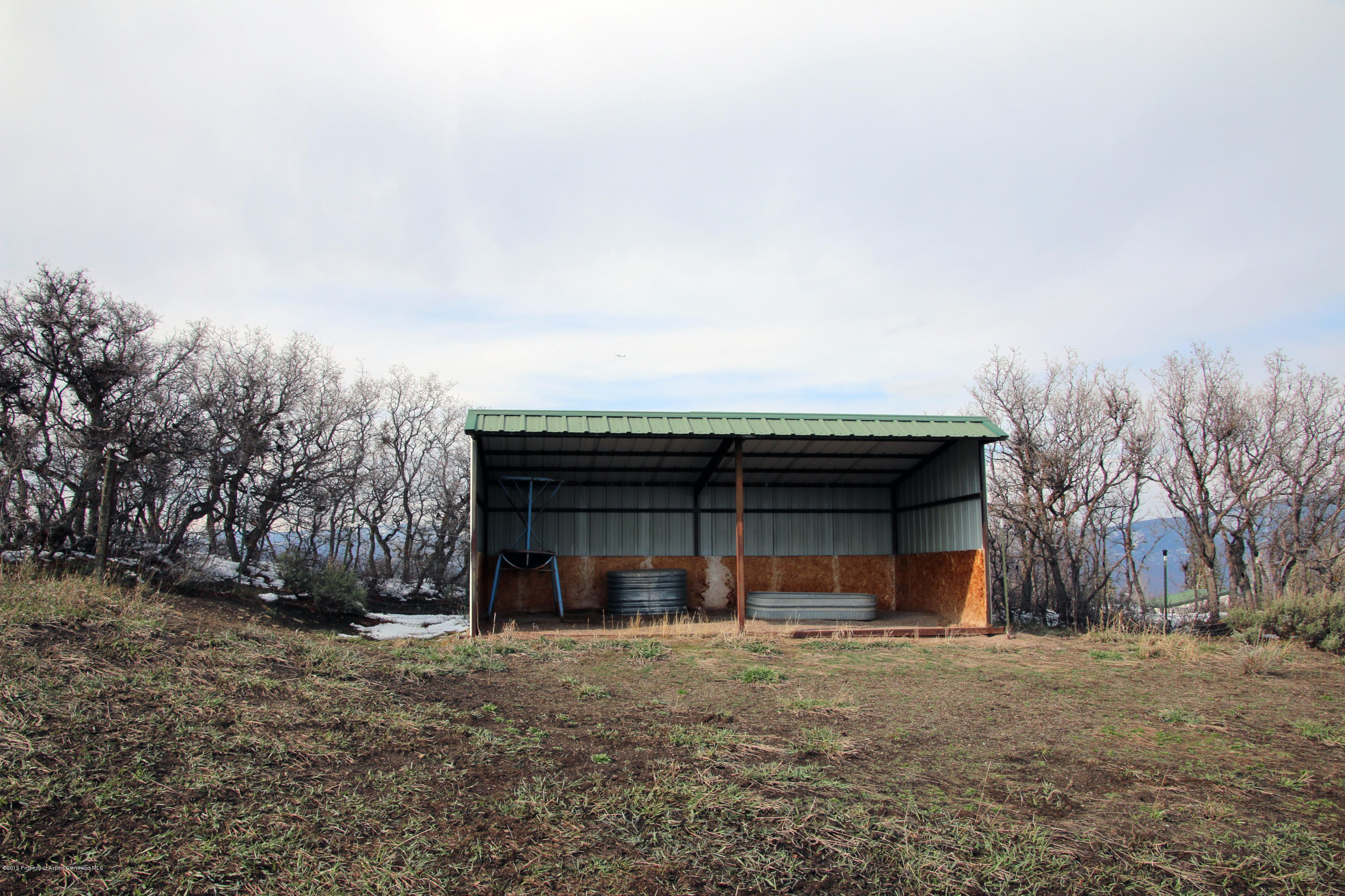 4000 Juniper Hill Road Aspen, CO 81611 - Photo 43 of 63 a view of a house with a yard and garage