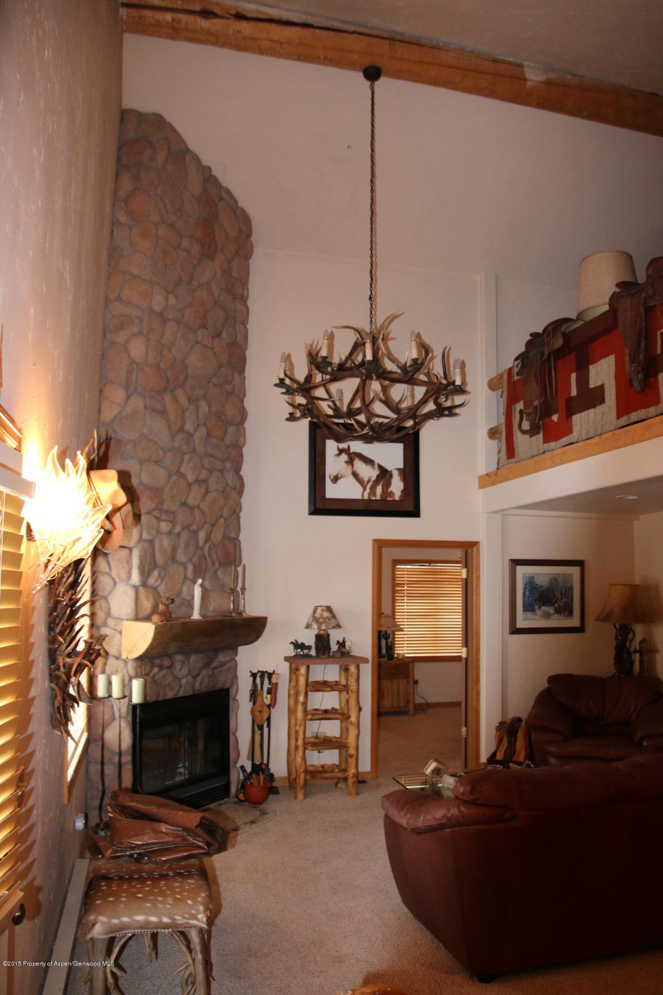 4000 Juniper Hill Road Aspen, CO 81611 - Photo 46 of 63 a view of a livingroom with furniture and a flat screen tv