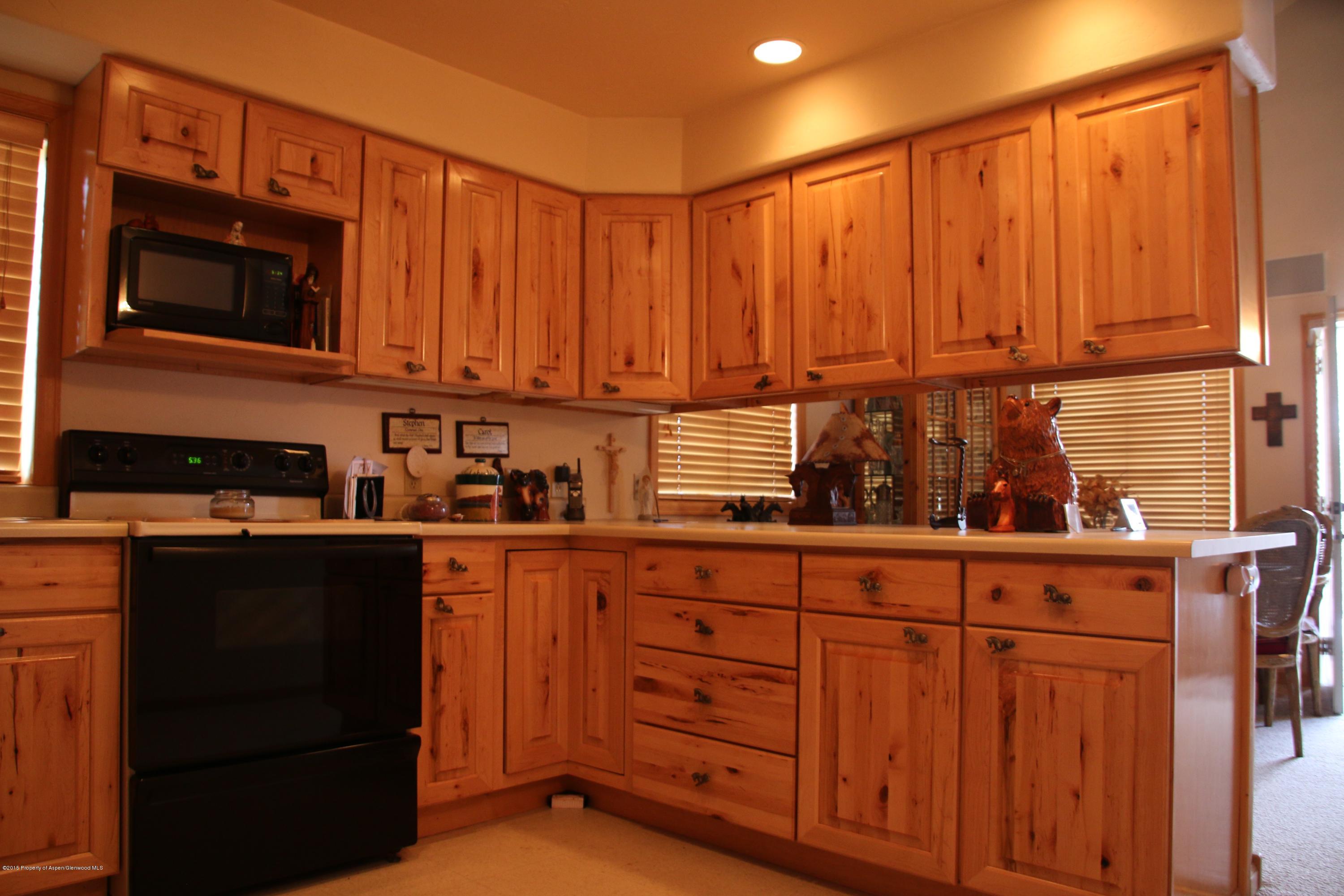 4000 Juniper Hill Road Aspen, CO 81611 - Photo 50 of 63 a kitchen with stainless steel appliances wooden cabinets and a sink