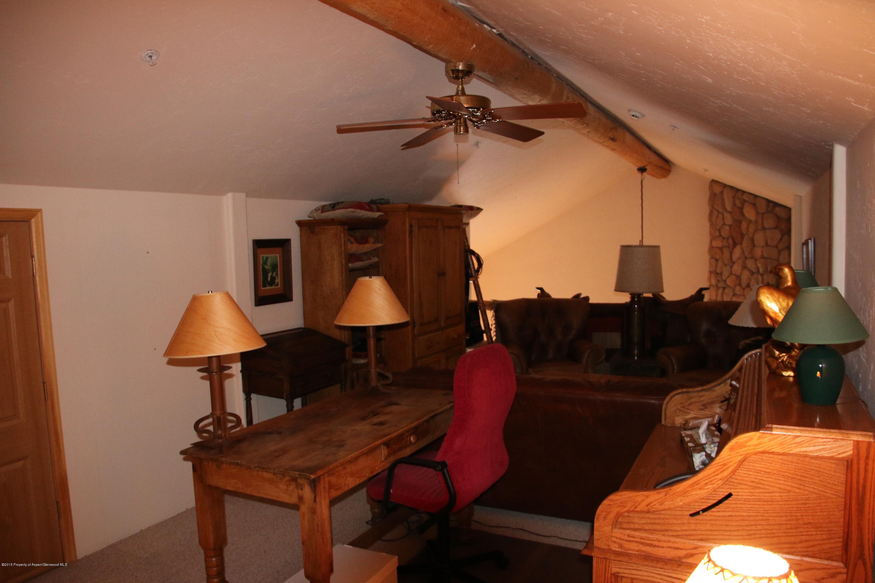 4000 Juniper Hill Road Aspen, CO 81611 - Photo 53 of 63 a lamp on a table in a room
