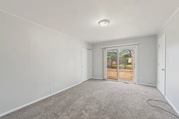 an empty room with large window