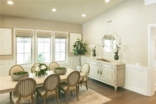 a view of a dining room with furniture and window