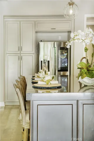 a dining table chair next to a window