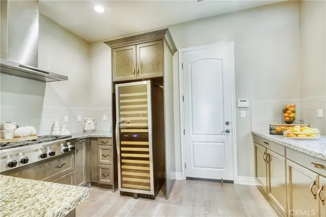 a kitchen with stainless steel appliances granite countertop a sink and cabinets