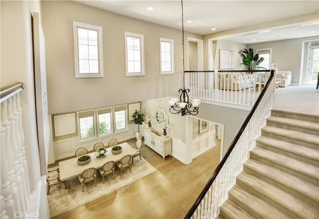 a view of an entryway with wooden floor and windows