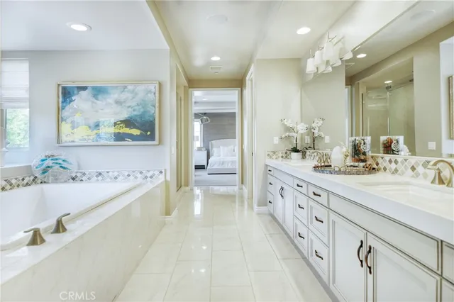 a kitchen with a refrigerator sink stove and cabinets