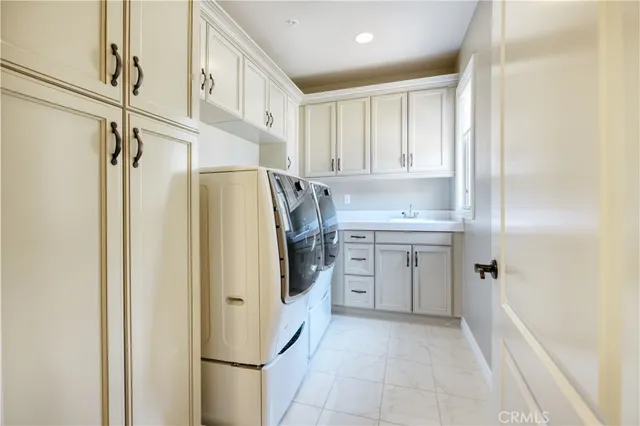 a view of a patio with table and chairs potted plants with wooden floor and fence