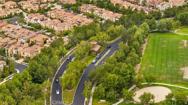 a view of a swimming pool with a table and chairs under an umbrella