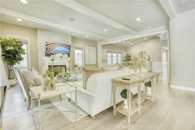 a living room with furniture a dining table and chairs