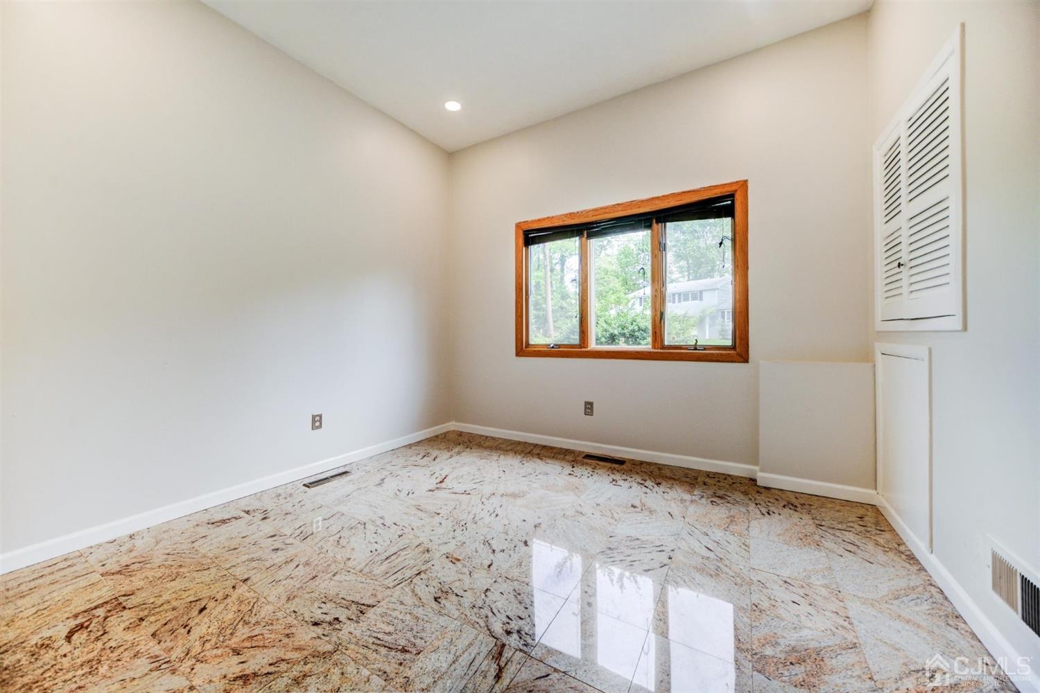 19 Greenwich Road Edison, NJ 08820 - Photo 14 of 39 a view of an empty room and window