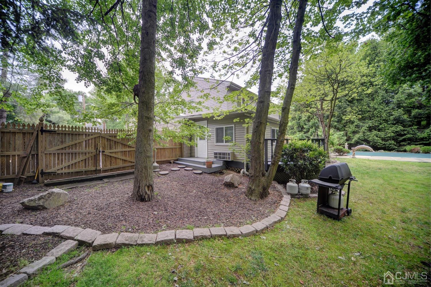 19 Greenwich Road Edison, NJ 08820 - Photo 36 of 39 a view of a house with a backyard