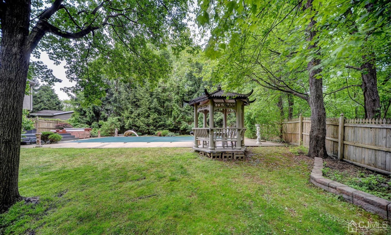 19 Greenwich Road Edison, NJ 08820 - Photo 37 of 39 a view of a house with backyard and a tree