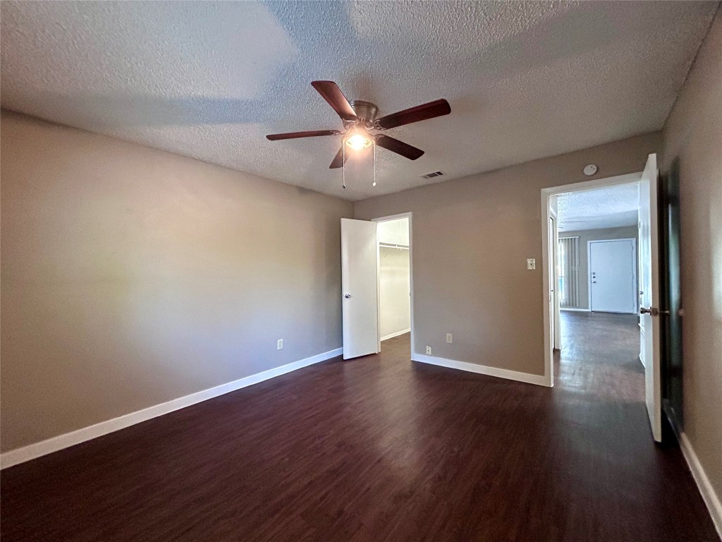 1500 No Mor Cove, Unit B Austin, TX 78758 - Photo 12 of 17 a view of an empty room with wooden floor