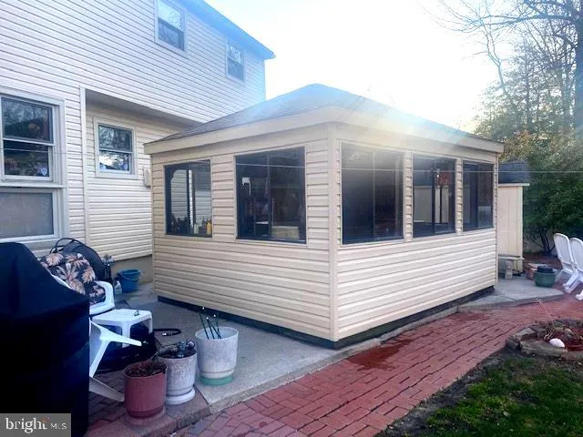 a view of a two chairs in front of house
