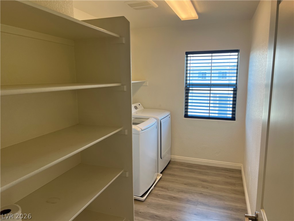 9581 Aberdeen Ridge Court Las Vegas, NV 89148 - Photo 15 of 25 Ample storage solutions and convenient laundry facilities define this functional space.