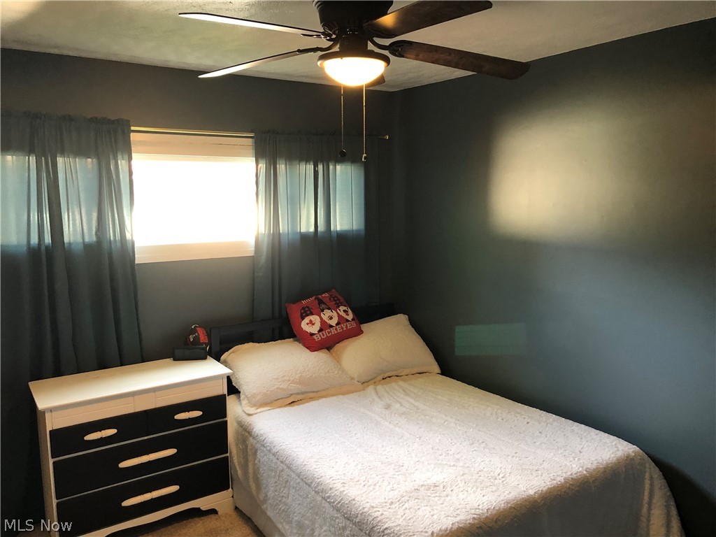 6374 Sherborn Road Parma Heights, OH 44130 - Photo 14 of 19 Nice sized bedroom with newer carpeting and a lighted ceiling fan.