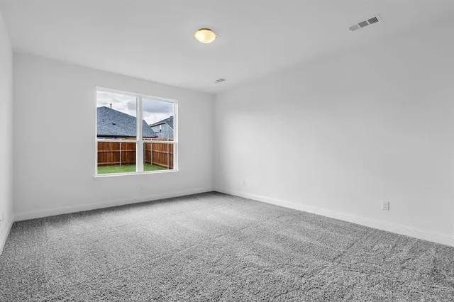 a bathroom with a granite countertop sink two mirror and a shower