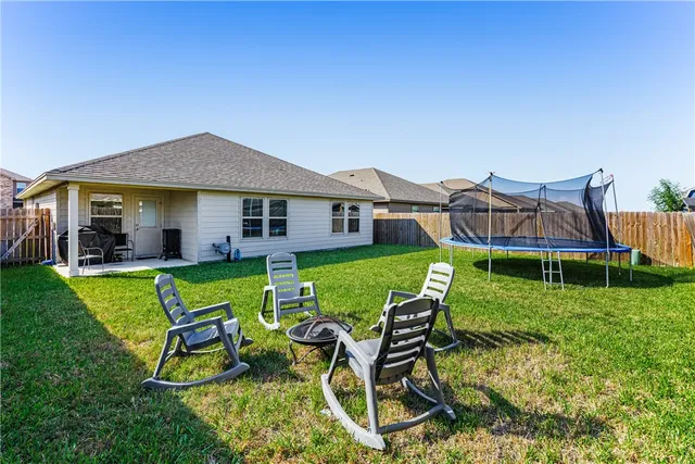 a view of an house with backyard porch and sitting area