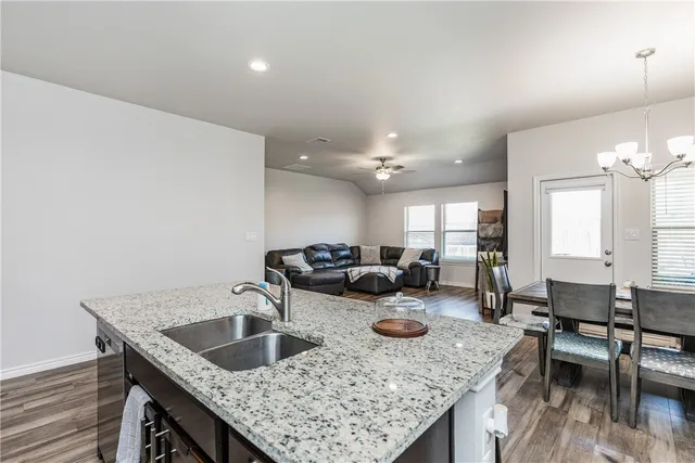 a kitchen with counter space and breakfast area