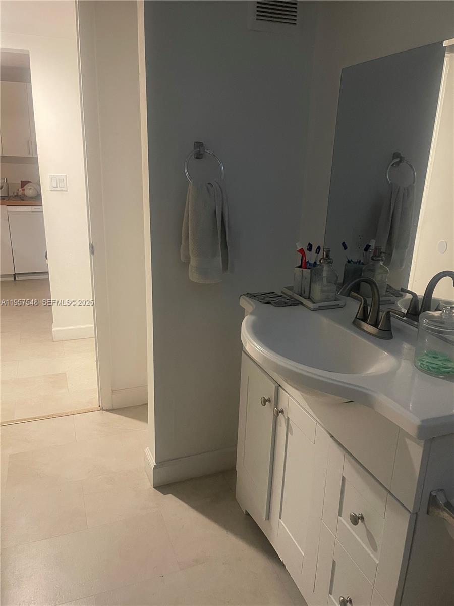 10525 Southwest 112th Avenue, Unit 315 Miami, FL 33176 - Photo 9 of 9 a bathroom with a sink and a mirror