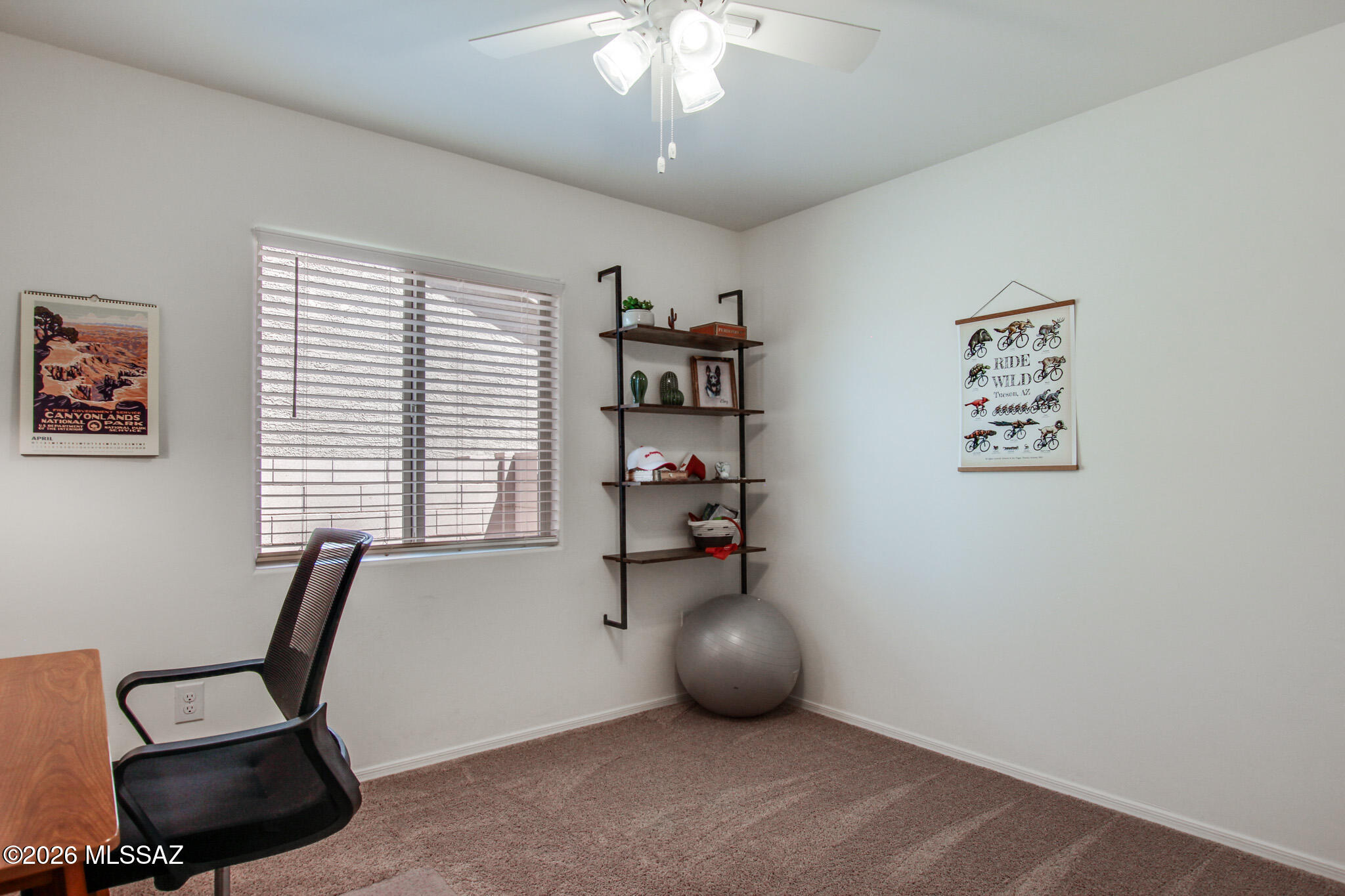 7056 South Draper Road Tucson, AZ 85757 - Photo 15 of 22 a view of workspace with a window and chair