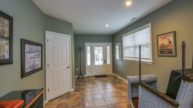 a room with furniture and wooden floor