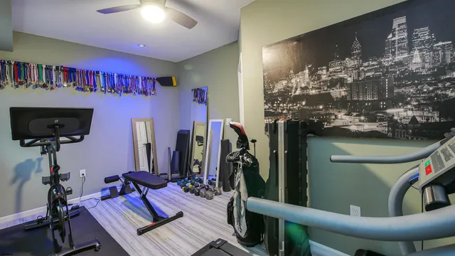 a bathroom with a glass door shower a sink and a mirror
