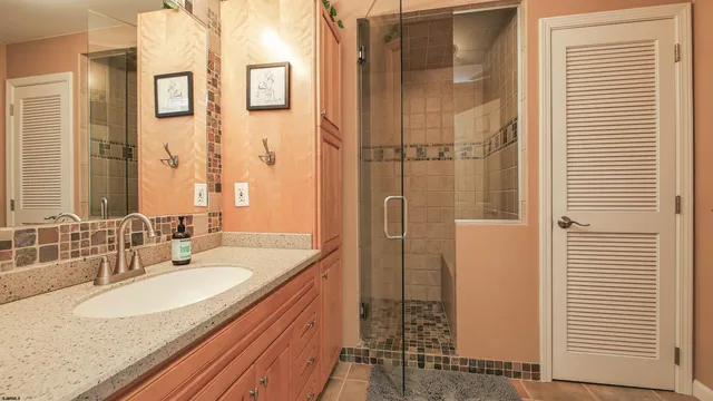 a kitchen with lots of counter top space and painting on the wall