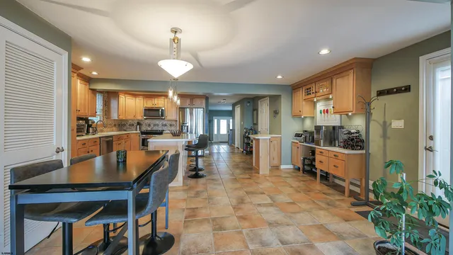 a living room with fireplace furniture and a wooden floor