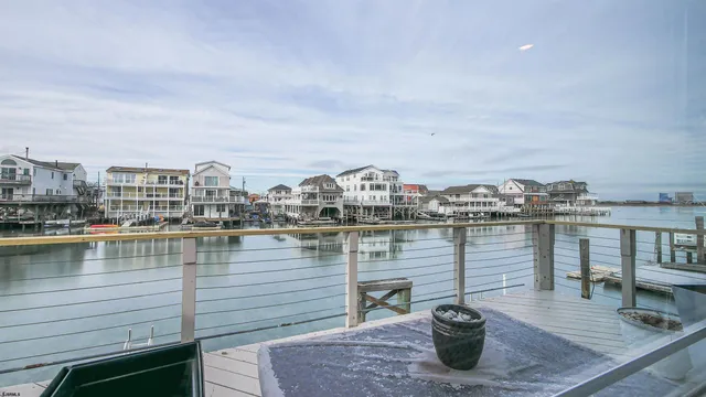 a living room with furniture a rug and a large window