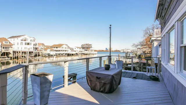 a view of a balcony with outdoor seating