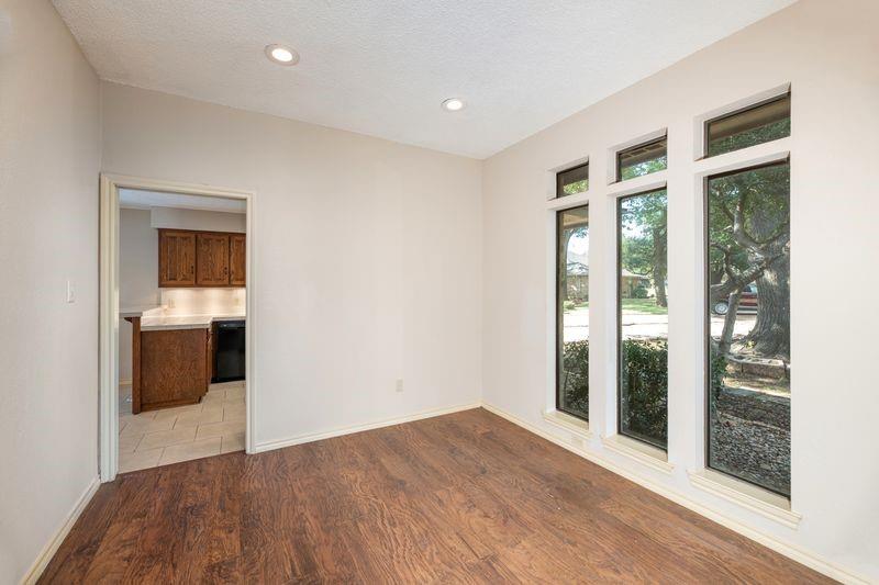 922 Kingston Drive Mansfield, TX 76063 - Photo 6 of 24 a view of a room with wooden floor and windows