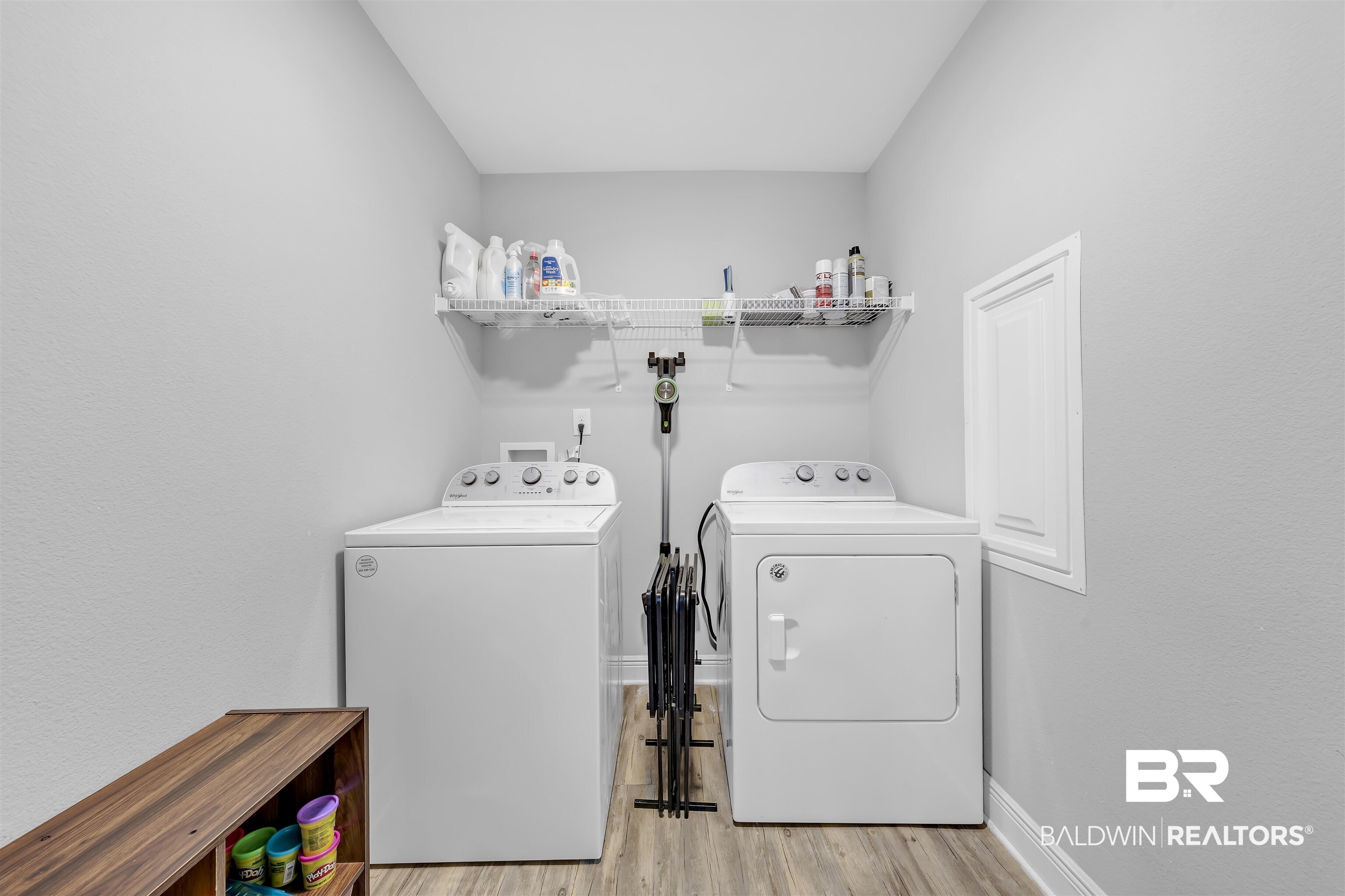 15570 Medway Court Foley, AL 36535 - Photo 19 of 25 Washroom featuring light wood-type flooring and washing machine and clothes dryer