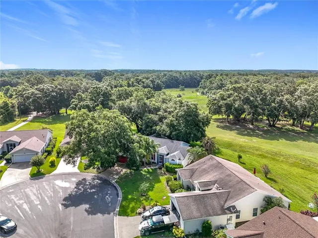 a bedroom with furniture and wooden floor