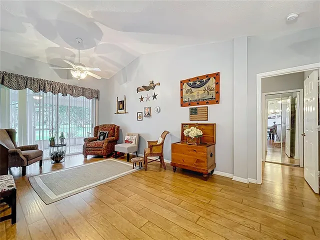 a view of a dining room with furniture and wooden floor