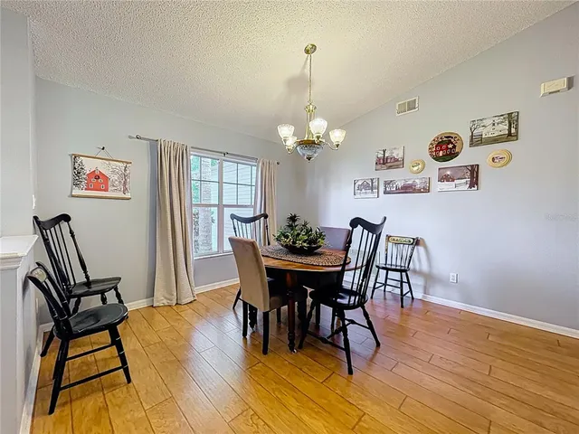 a kitchen with cabinets a sink and white appliances
