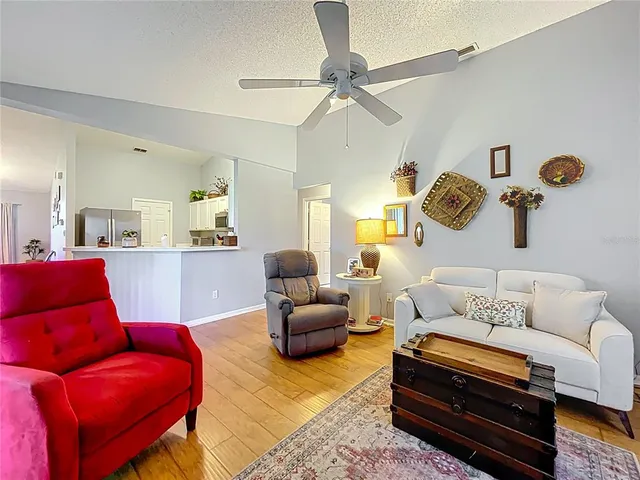 a bathroom with a granite countertop sink a mirror and a toilet