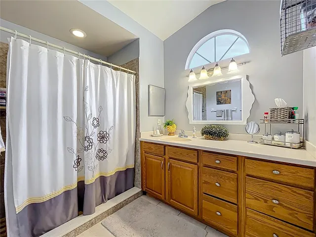 a view of a house with a yard and porch