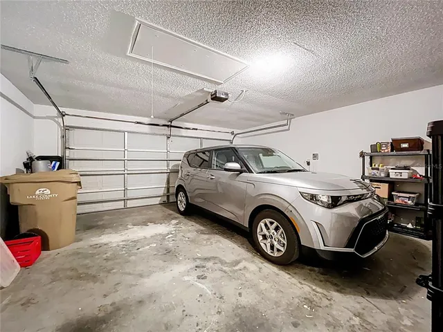 an aerial view of residential houses with outdoor space and street view
