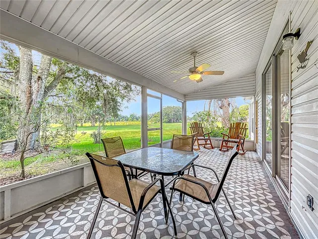 an aerial view of residential houses with outdoor space and swimming pool