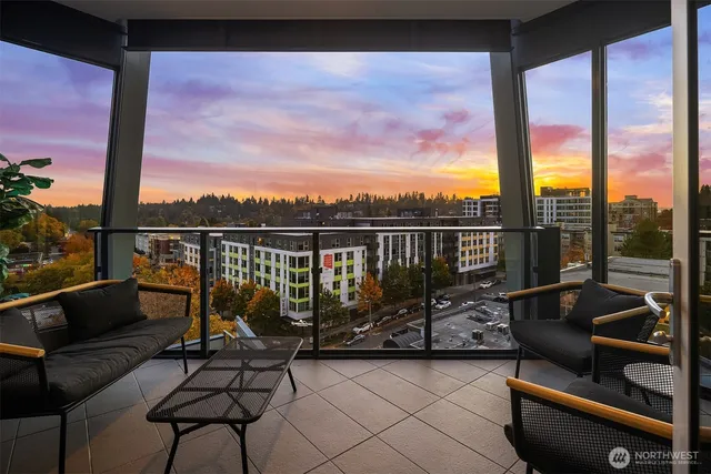 a bedroom with a large bed and a large window