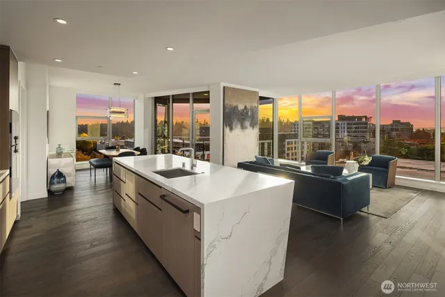 a living room with furniture and a floor to ceiling window