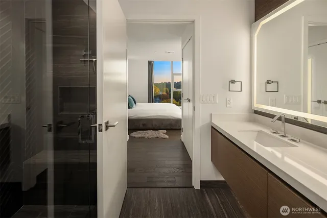 a large kitchen with stainless steel appliances granite countertop a lot of counter space and a sink