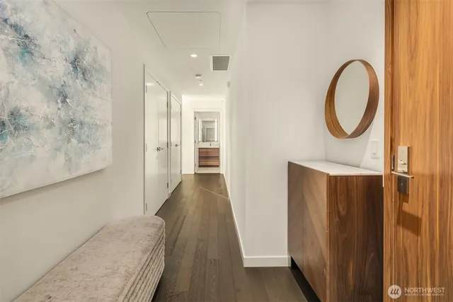 a bathroom with a toilet a sink and a mirror