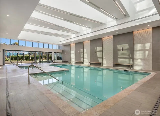 a lobby with furniture and floor to ceiling window