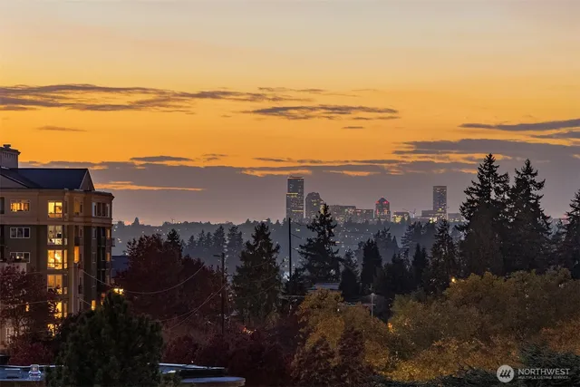 a living room with couches a coffee table and a flat screen tv