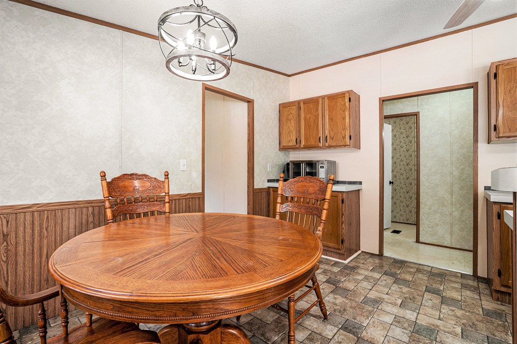 359 Norton Bridge Road Chatsworth, GA 30705 - Photo 11 of 28 a dining room with furniture and window